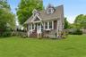 View of front of property with roof with shingles