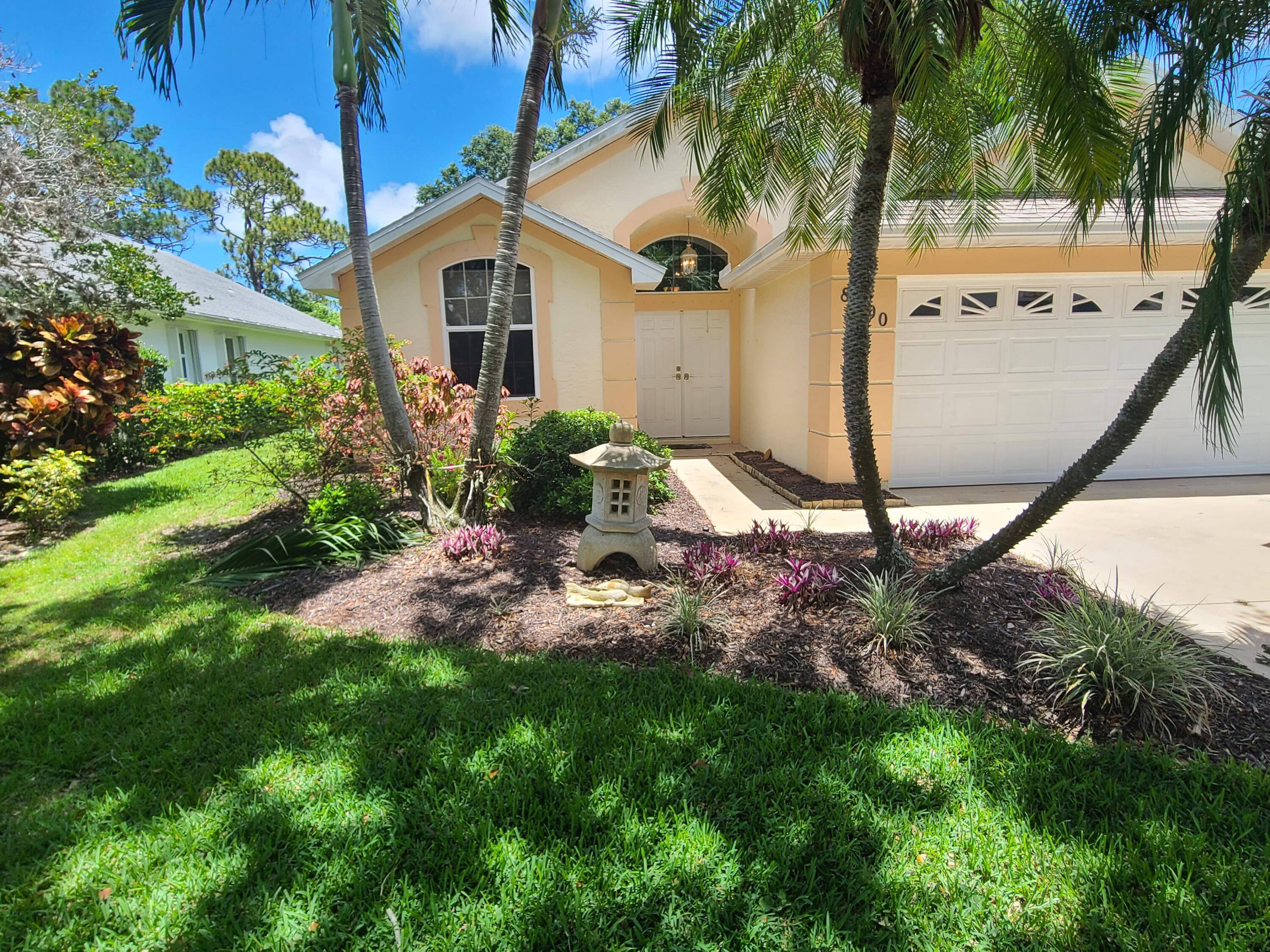 3 2 2 CBS Home nestled in Lake Lucie with tree lined streets.