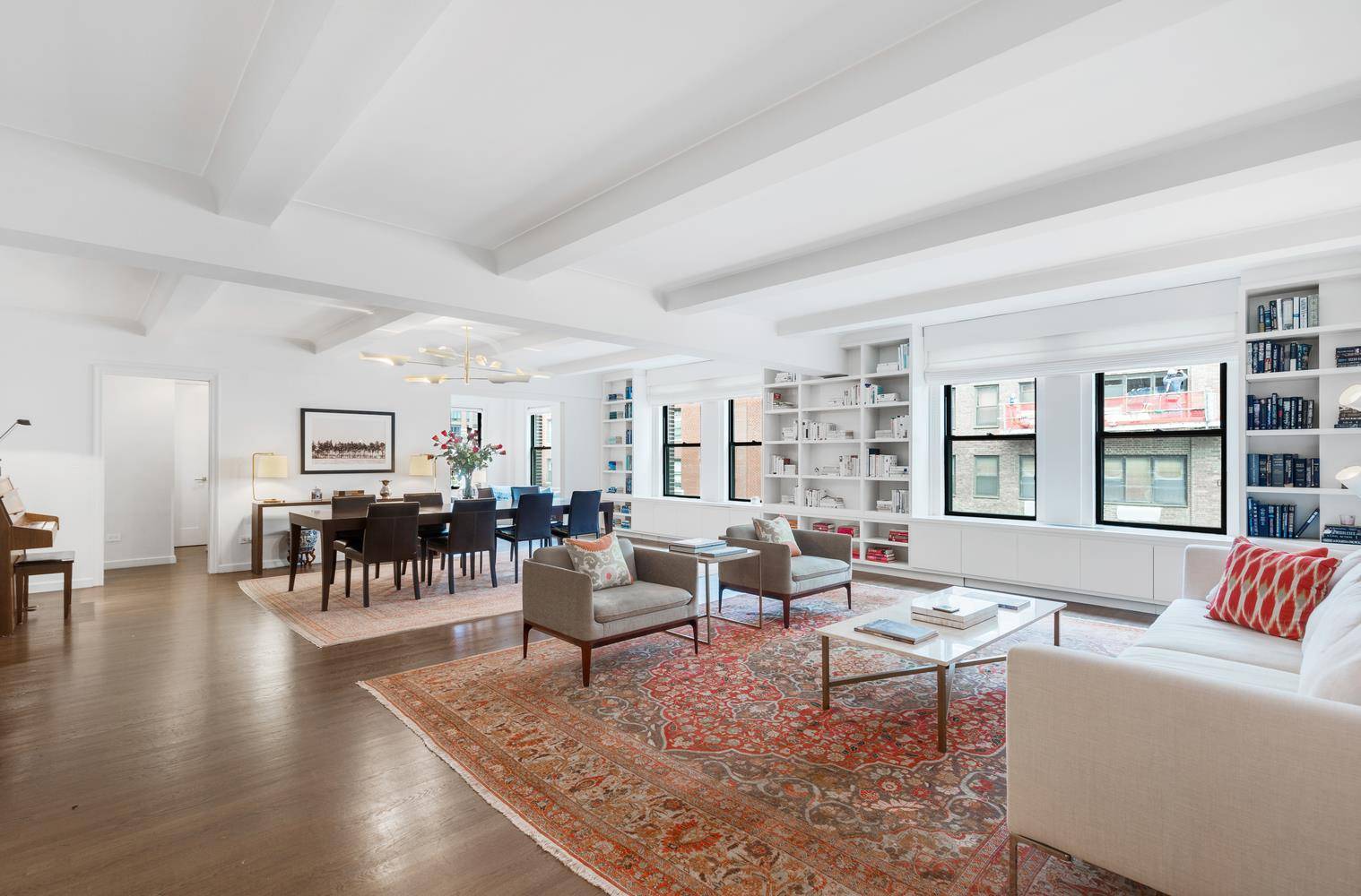 This luxurious Three Bedroom with Library, Two and a half Bathroom cooperative encompasses two adjacent apartments that were combined and meticulously renovated to create a magnificent prewar home.