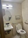 Bathroom featuring tile patterned floors and tile walls