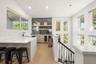 wet bar area with cigar humidor and wine fridge