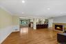 Living room with wainscoting, fire-place & hardwood floors