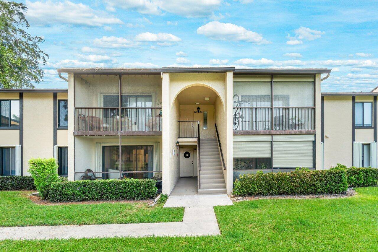 ADULT 55 Community. LAKEVIEW corner unit with 3 Bedrooms, 2 Bathrooms, screened covered patio.