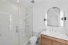 Full bathroom featuring vanity, a stall shower, and recessed lighting