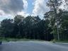 A private road welcomes you into an exclusive four-home cul-de-sac