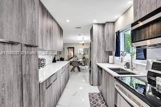 Experience modern coastal living in this beautifully renovated 4 bedroom, 3 bath home located in the coveted Hollywood Lakes neighborhood.