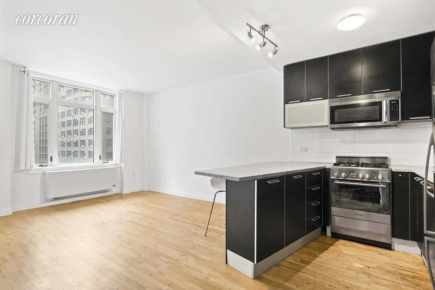 Beautiful and quiet east facing chic luxury 1 bed 1 bath with balcony in the heart of Midtown West Hell's Kitchen.