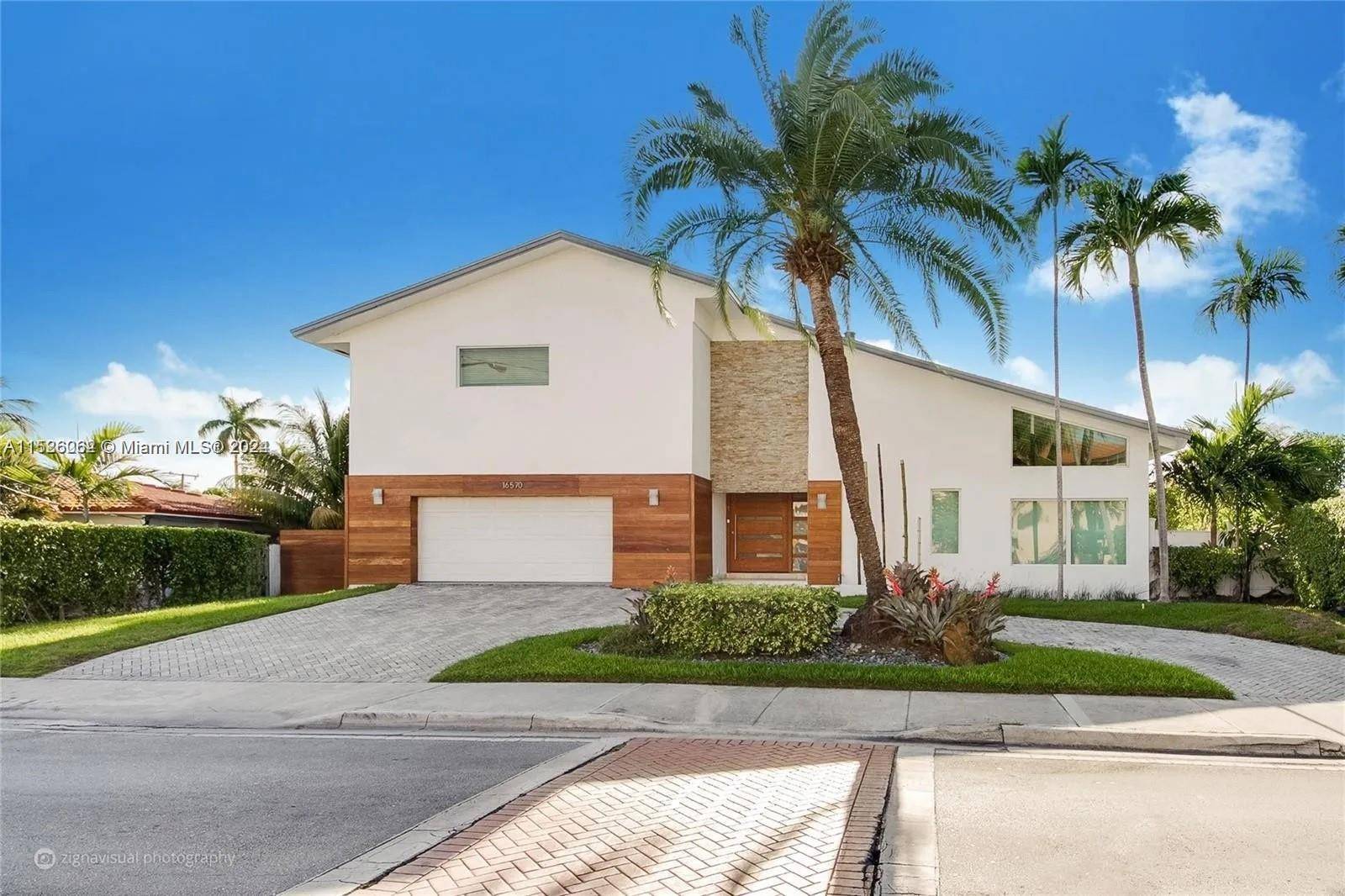 Gorgeous modern 4 bedroom 4 bath waterfront home in desirable Eastern Shores community of Sunny Isles.