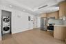 Kitchen featuring modern cabinets, stainless steel appliances, recessed lighting, light wood finished floors, and tasteful backsplash