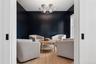 Living area featuring a notable chandelier and light wood-style floors