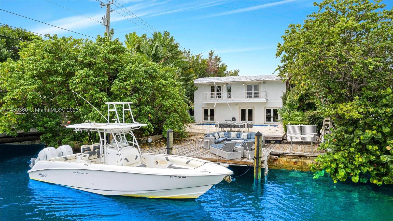 Charming waterfront Mediterranean villa on the coveted Venetian Islands offers the perfect opportunity to renovate or build your dream home in paradise.