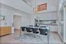 Great room Dining area open to kitchen island with a notable chandelier