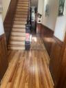 Stairs featuring hardwood / wood-style flooring, a wainscoted wall, and wooden walls