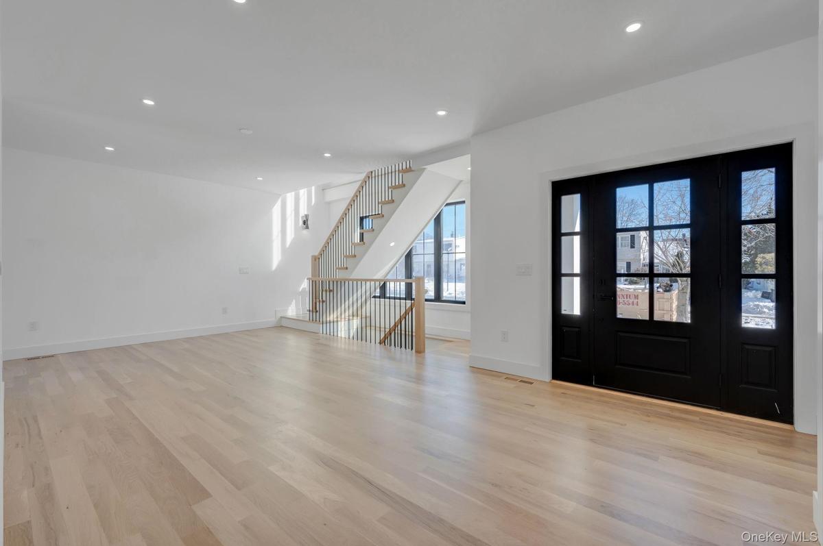 Bright and welcoming entry with clean architectural lines and natural light that immediately sets the tone of the home.