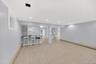 Finished lower level equipped with summer kitchen, bonus room & updated full bathroom