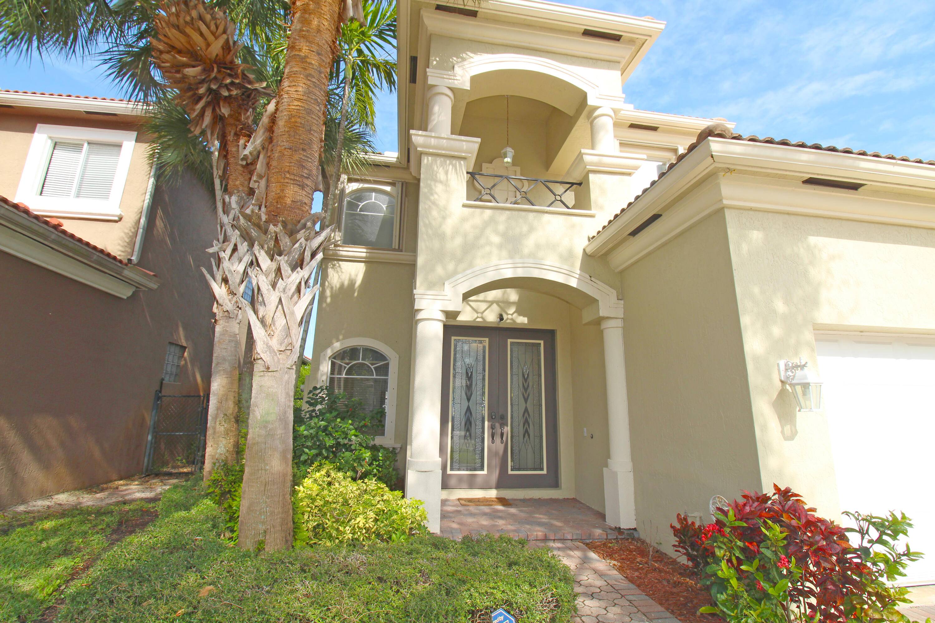 A must see in the highly desirable gated community of Palmyra Estates in Boynton Beach.