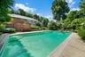 In ground pool with diving board and walk-in steps ... 38 ft wide ... 3FT low end up to 9FT deep end