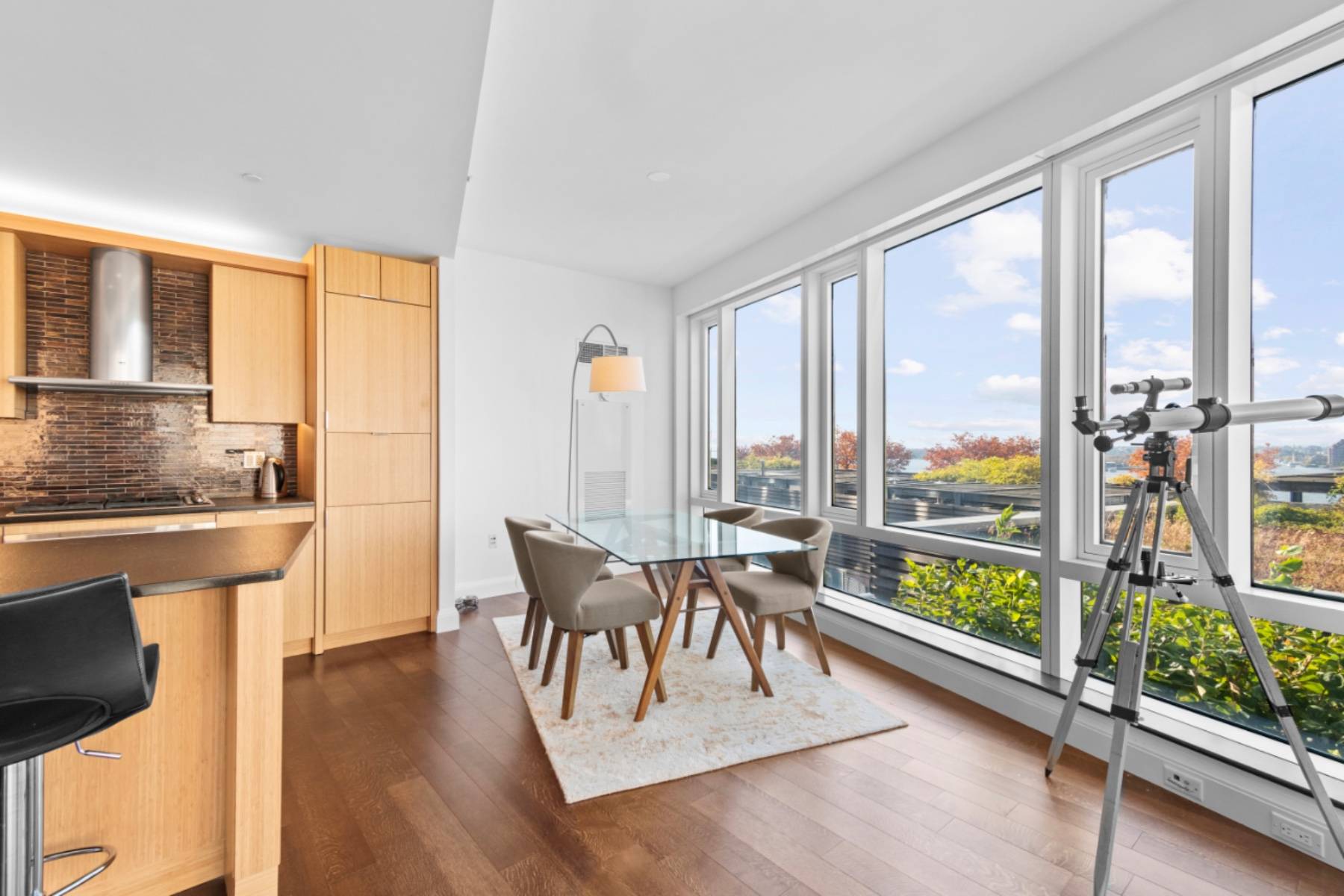 Indulge in the breathtaking Hudson River views from this expansive corner two bedroom residence at the acclaimed Visionaire Condominium.