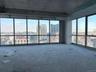 Unfurnished room with a city view and unfinished concrete floors