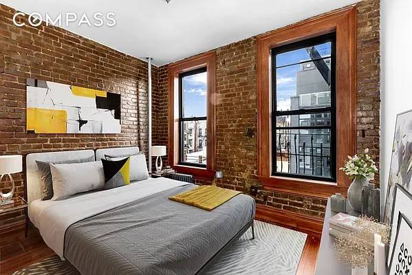 STEPS TO SOHO Sun drenched 1BD 1BA with Open S S Kitchen, King Size Bedroom, Sprawling Hardwood Floors, Exposed Brick, Tall Ceilings, and On Site Laundry Step inside this sun ...