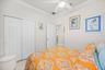 Guess Bedroom Featuring a Coffered Ceiling and Crown Molding