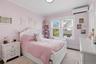 Super cute bedroom with hardwood flooring (note all the bedrooms have closets) (#220)