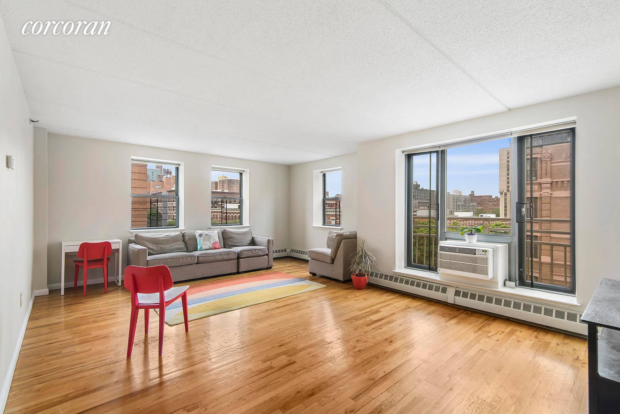 This is it ! A three bedroom, two bath, sun filled apartment with unobstructed views in Manhattan for well under 1M.