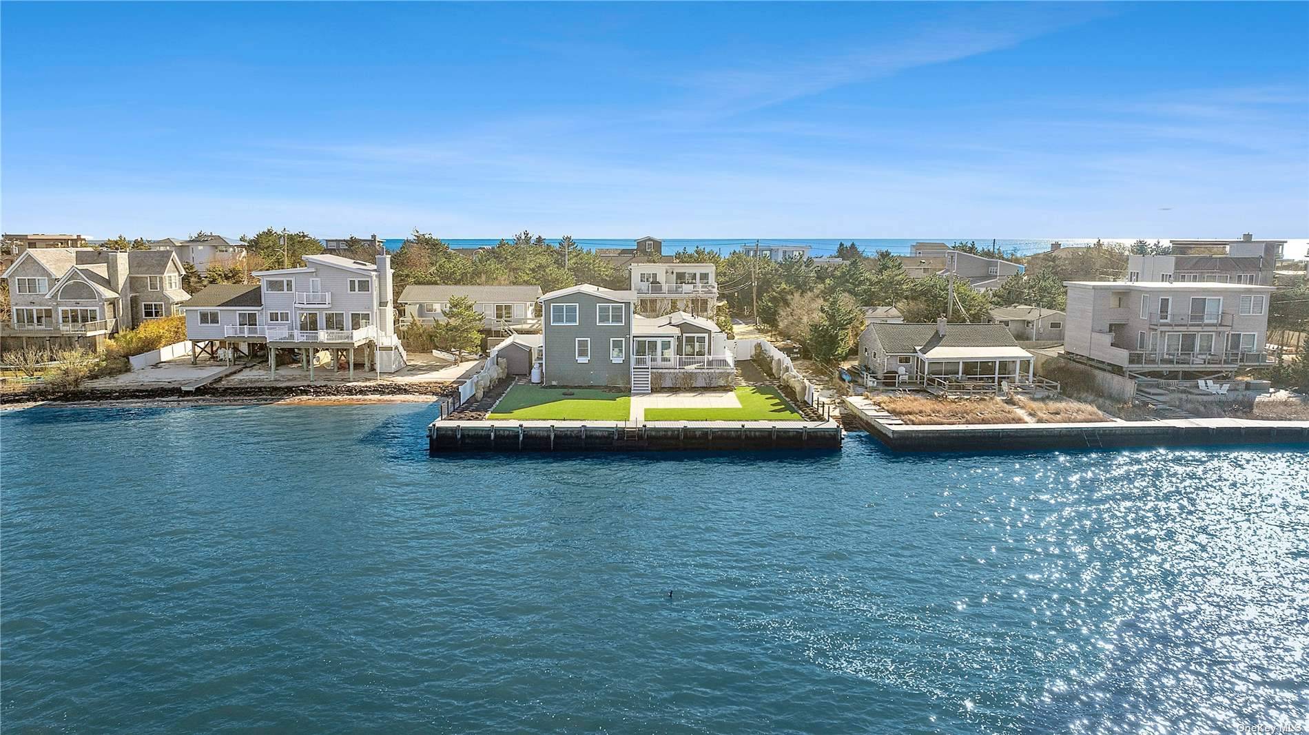 Nestled in the heart of Westhampton Beach, this turnkey bayfront property offers an idyllic blend of coastal living and modern comfort.