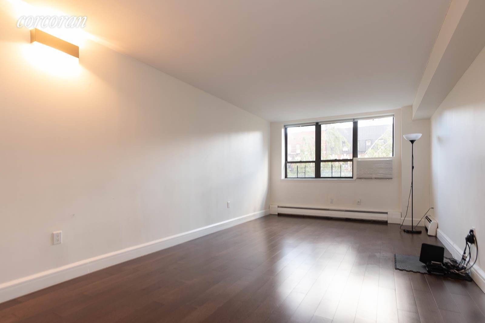 This spacious two bedroom apartment has bright windows facing South in all rooms !