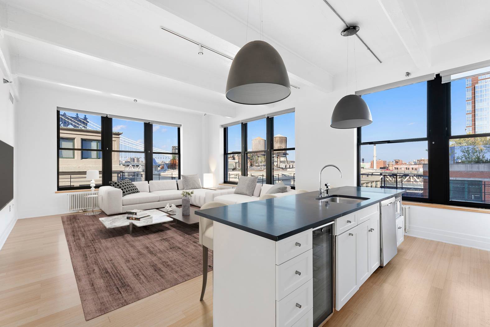Stunning and spacious, high floor, corner loft with two bedrooms plus a home office that's easily convertible to a third bedroom, and three full bathrooms in the heart of Dumbo.