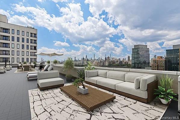 View of patio / terrace with a skyline view and outdoor lounge area