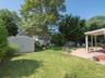View of yard featuring a patio area and a shed