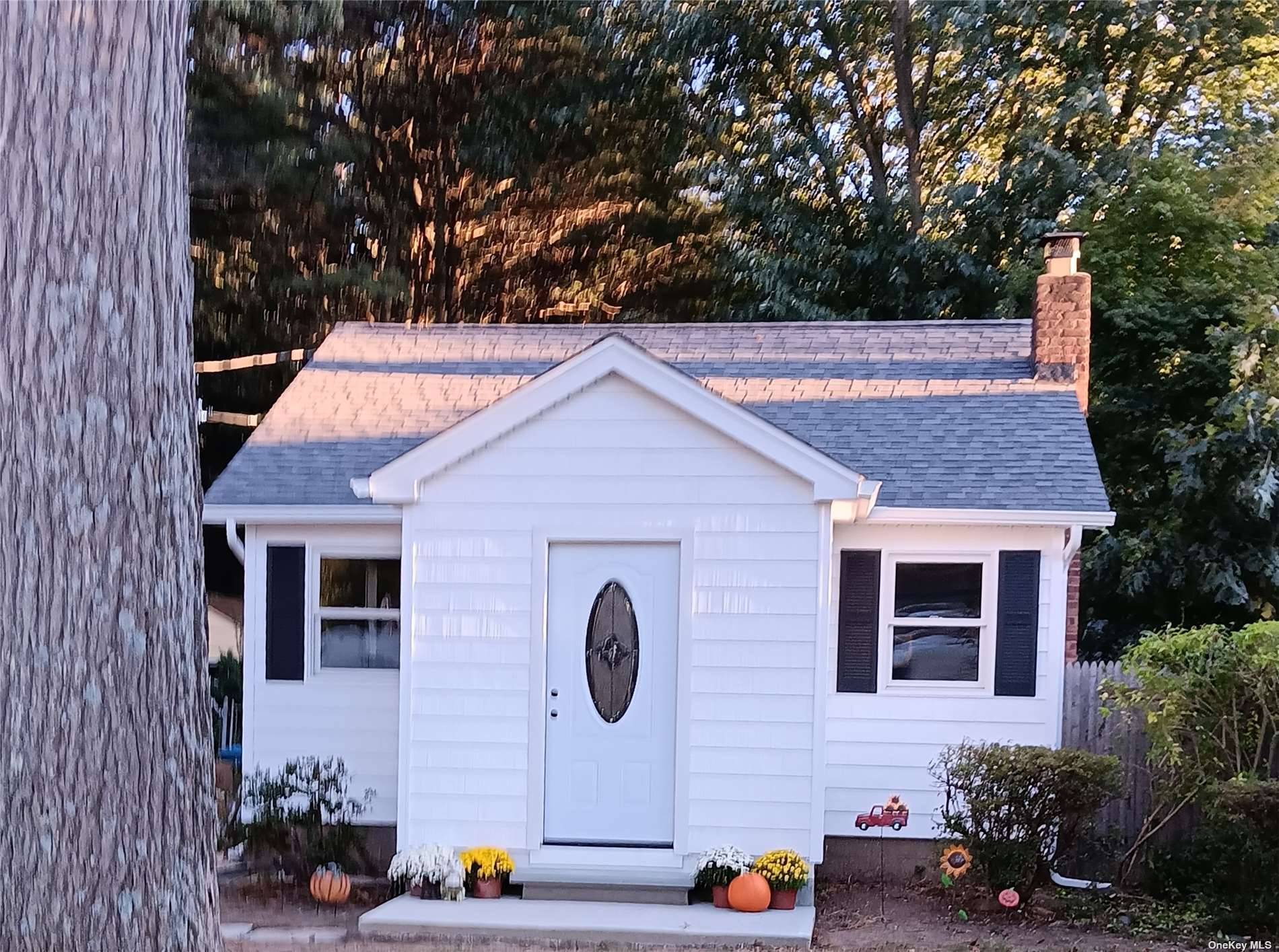 The exterior of this Cozy Cottage has been updated with a new roof, siding, doors and windows.