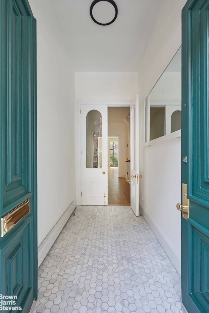 Welcome to this exquisitely restored landmark Italianate style townhouse that is available for rent as a tri level unit.