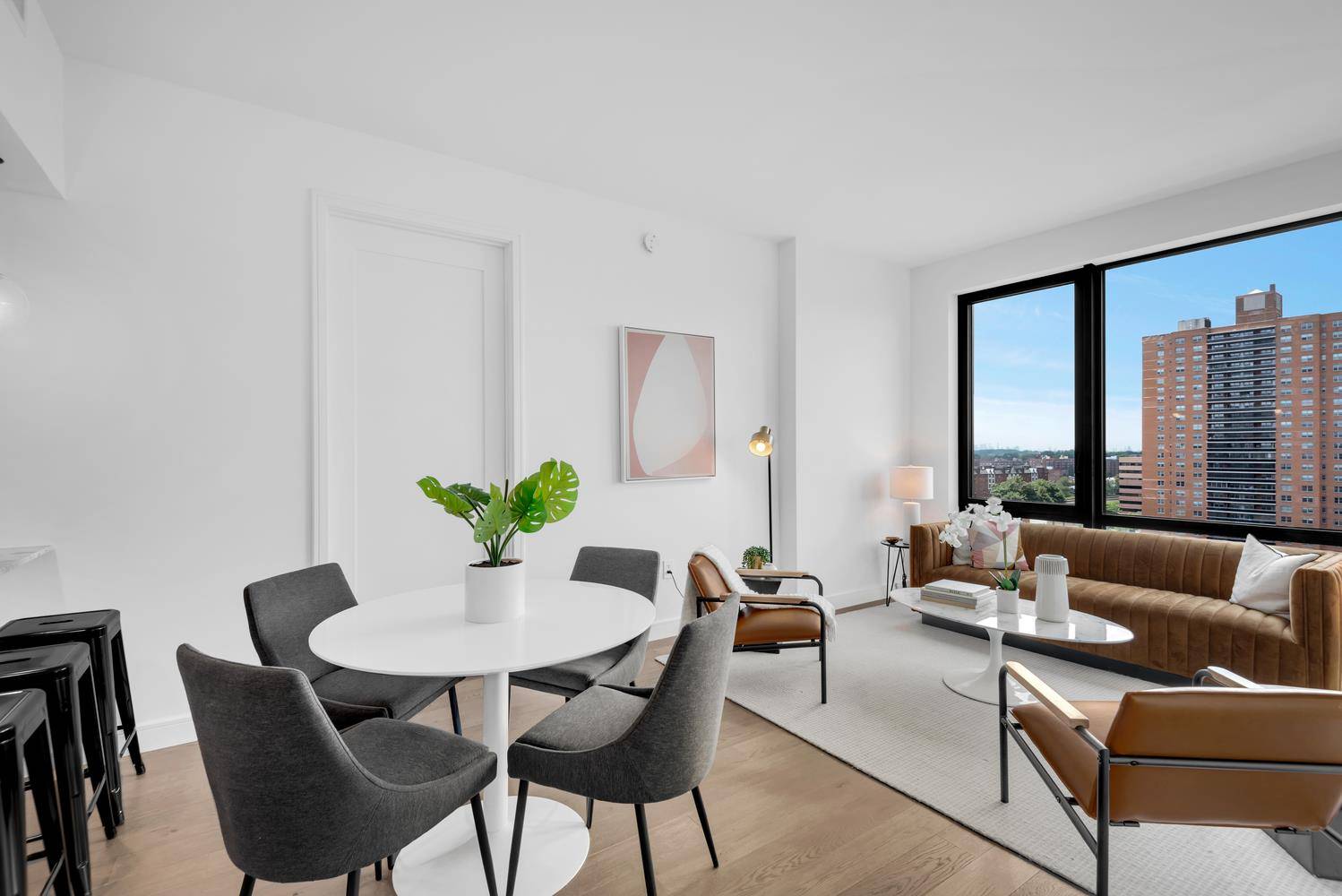 Introducing Residence 9C at BLVD, a stunning two bedroom, two bathroom condominium with balcony that offers an unparalleled living experience in the heart of Forest Hills.