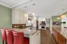 Beautiful chefs kitchen with granite countertops and stainless steel appliances.