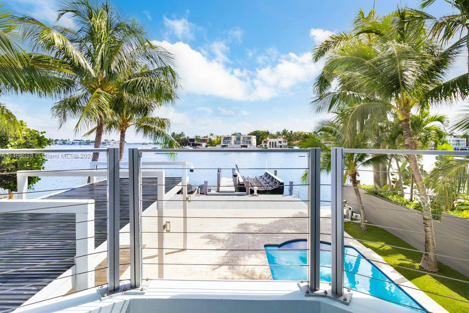 This spectacular waterfront home has been totally renovated with a construction upgrade of a new entrance and third floor railings in 2019.