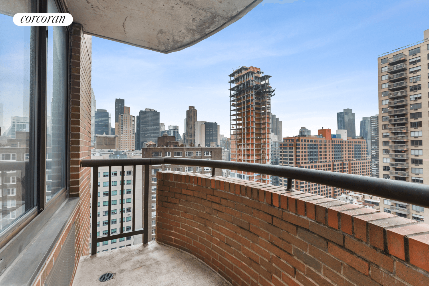 A luxurious and sundrenched, corner two bedroom two bath condo high in the sky !