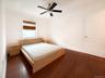 Bedroom featuring dark wood finished floors and a ceiling fan