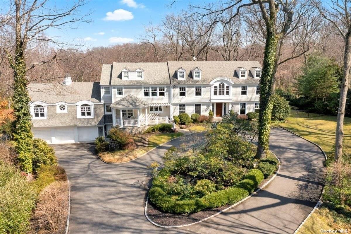 Nestled at the end of a secluded cul de sac, on a private road, lies one of Oyster Bay Cove's most extraordinary properties.