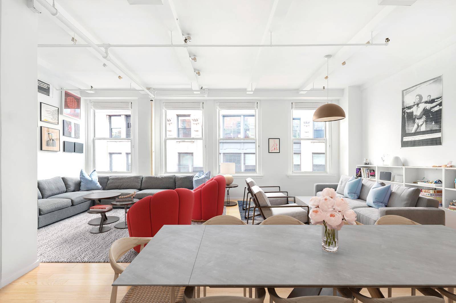 Light floods into this exceptional high floor Chelsea renovated loft from six south facing oversized windows.
