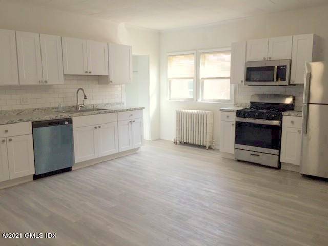 Heat water included. New kitchen and renovated bath in this expansive first floor apartment w space for everyone.