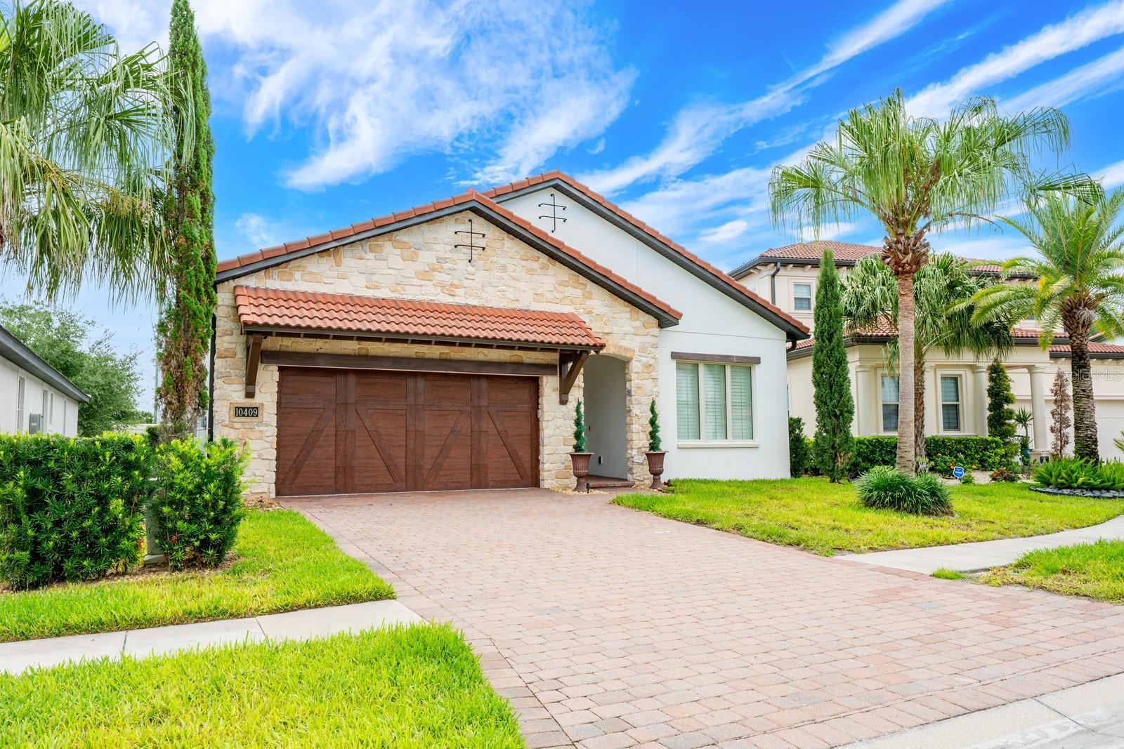 Welcome to this fully reimagined, single-story floor plan in the GUARD GATED COMMUNITY of Royal Cypress Preserve, just minutes from Walt Disney World!