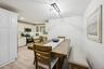 Dining area with recessed lighting and light wood-type flooring