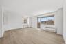 Spacious living room with plenty of windows and natural light