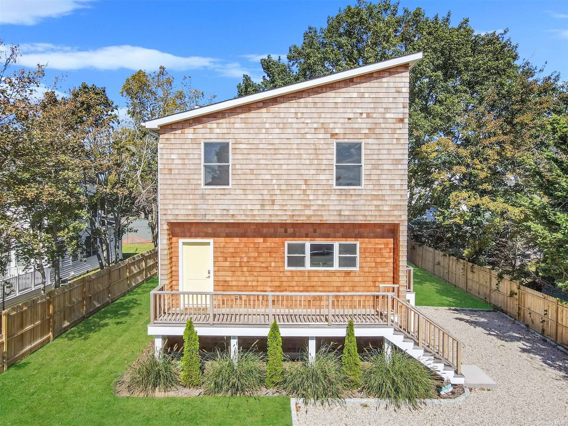 Introducing a modern 2 story residence nestled in the charming village of Greenport.