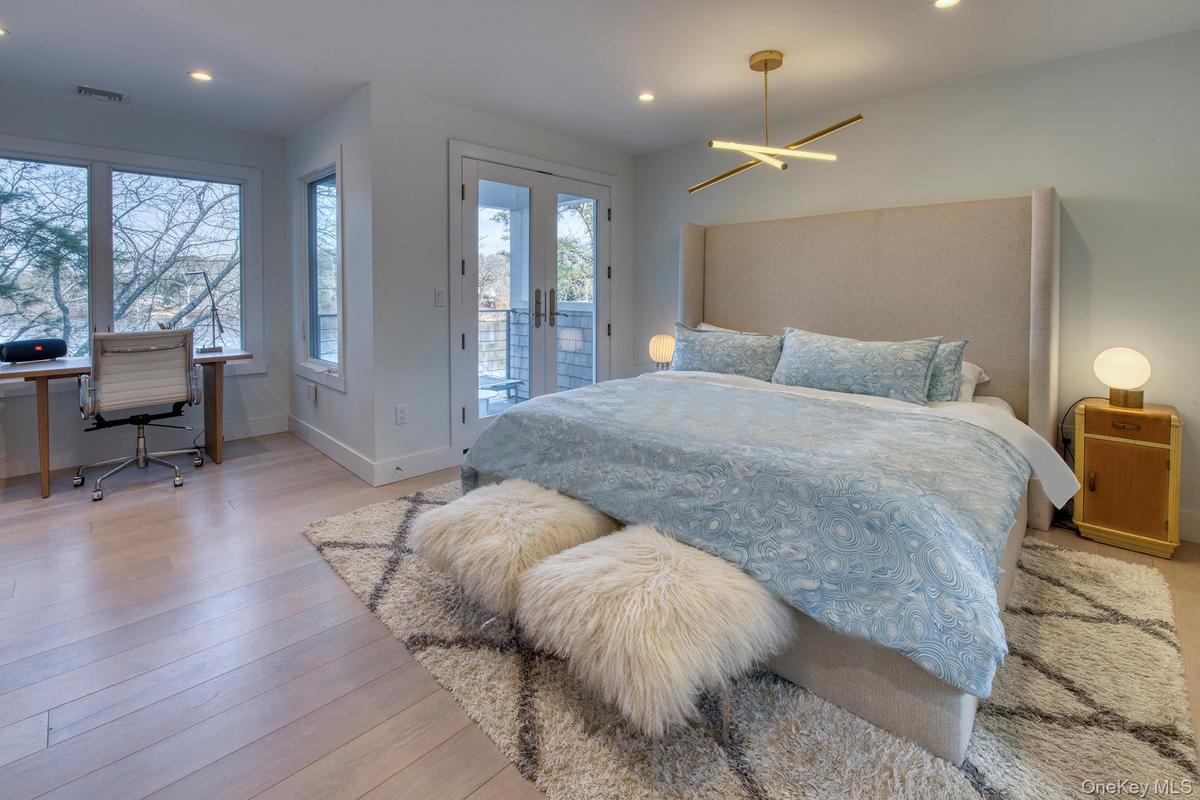 Bedroom featuring access to exterior, french doors, visible vents, light wood-style floors, and baseboards
