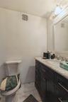 1st Floor full bathroom with vanity and toilet