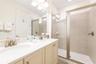 Primary bathroom with dual vanities and walk in shower in Kissimmee Florida resort home