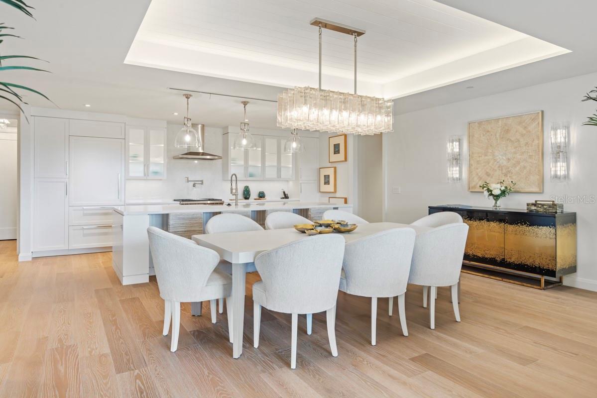 Dining area with tongue and groove ceiling details and lighting